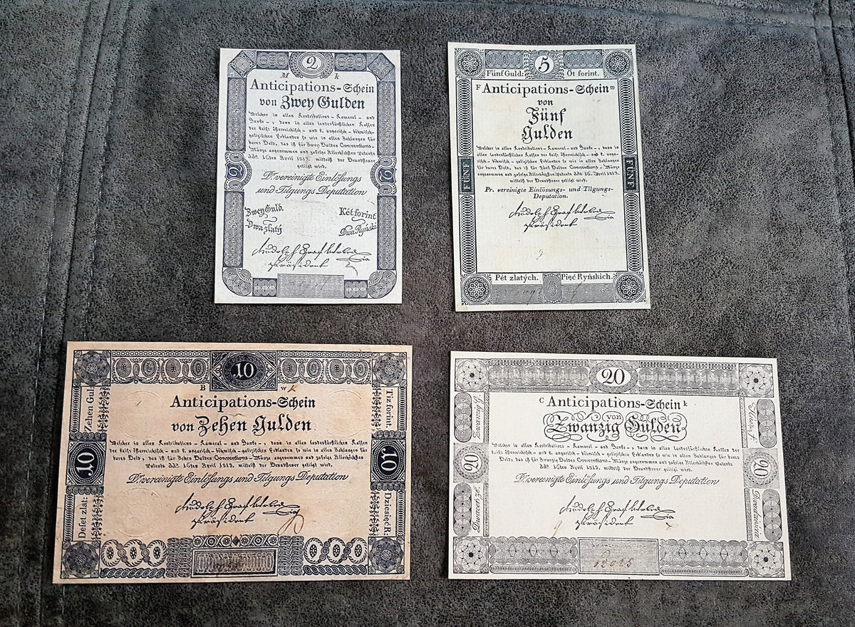 Obverse layout of the historical Austria 1813 series 2 Gulden and 5 Gulden emergency treasury notes. Features early nineteenth-century monochrome copperplate calligraphy, localized imperial signatures, and distinct central bank stamps.
