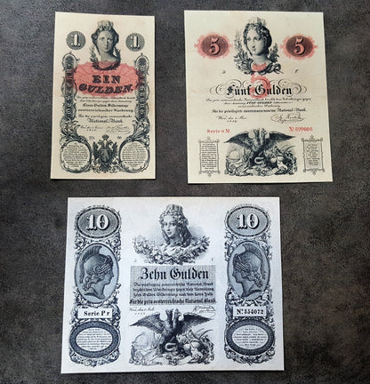 Obverse layout of the historical Austria 1858 series 1 Gulden and 5 Gulden imperial treasury notes. Features fine mid-19th-century monochrome copperplate calligraphy, localized signatures, and distinct central bank stamps.
