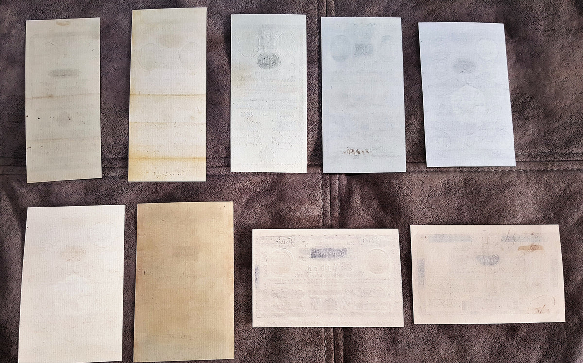 Reverse blank texture and traditional uniface backing details of early Austrian Empire 1800 banknotes. Showcases historical handmade security rag paper fibers and classic numismatic aging traits.