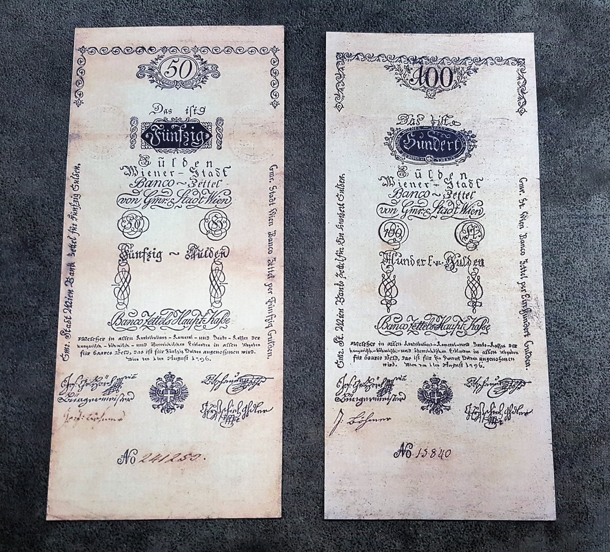 Obverse presentation of the 1796 series Austria Gulden treasury notes. Exhibits intricate early Austrian empire calligraphic scripts, traditional security border lathe work, and official financial signature blocks.