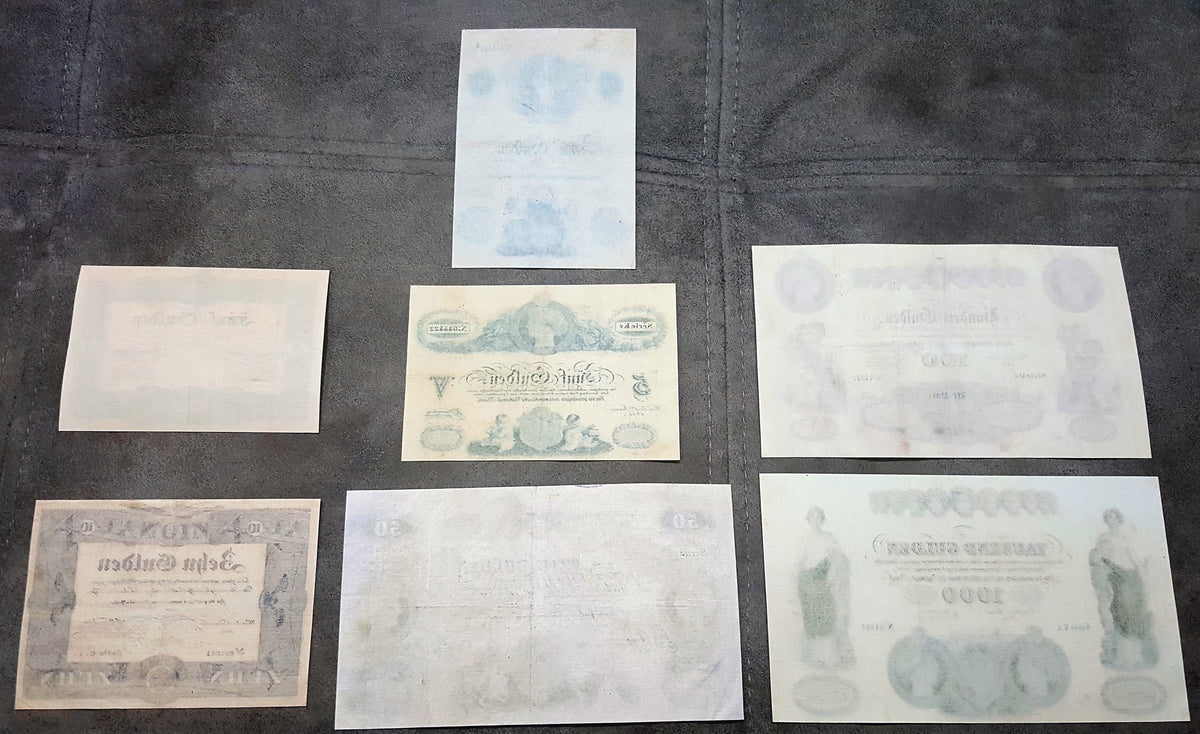 Reverse blank backing view of early Austrian National Bank uniface banknotes from the 1833 to 1841 series. Highlights the traditional handmade security rag paper textures, visible copperplate line indentations, and authentic historical document aging characteristics.