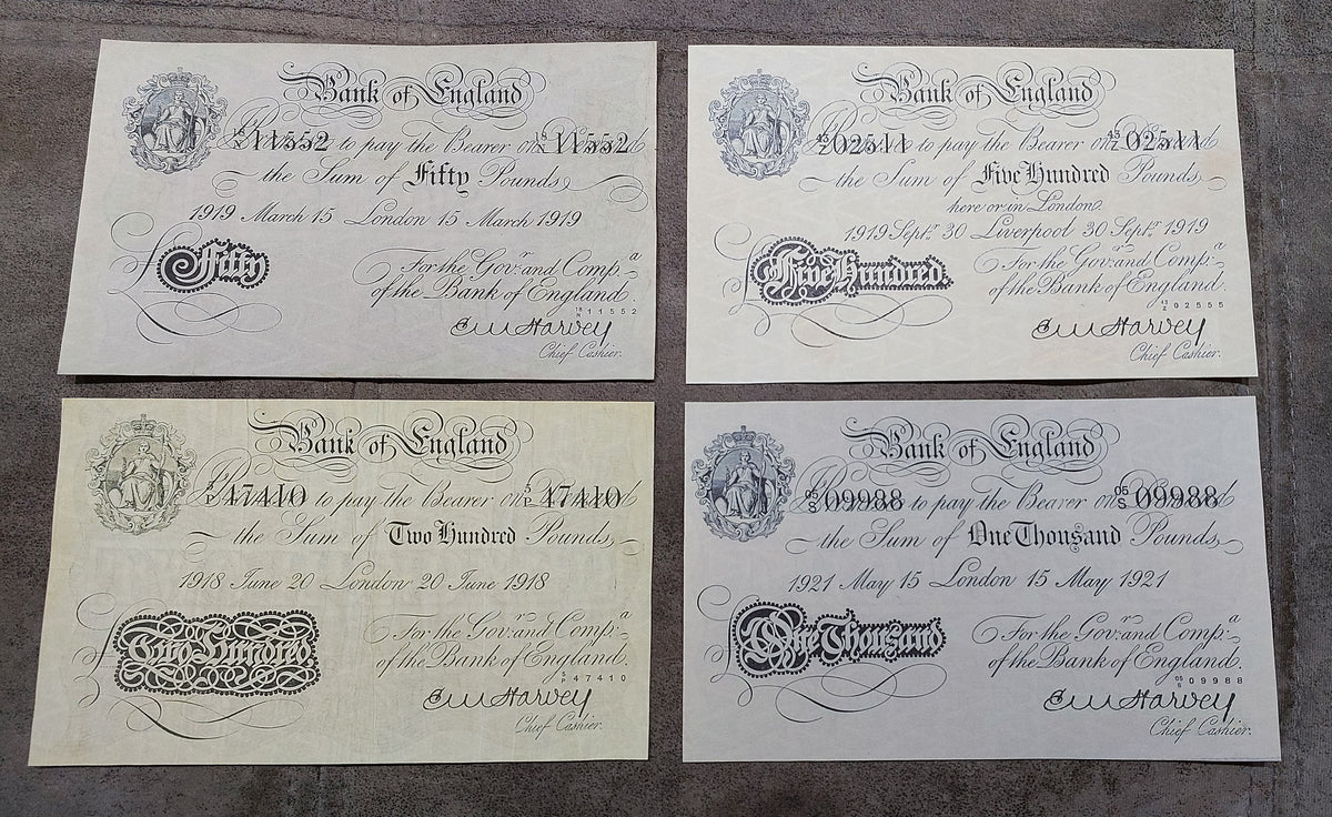 Four-note grid layout (quartet) featuring high-denomination £100 (Manchester 1923), £200 (London 1918), £500 (Liverpool 1919), and £1000 (London 1921) notes.