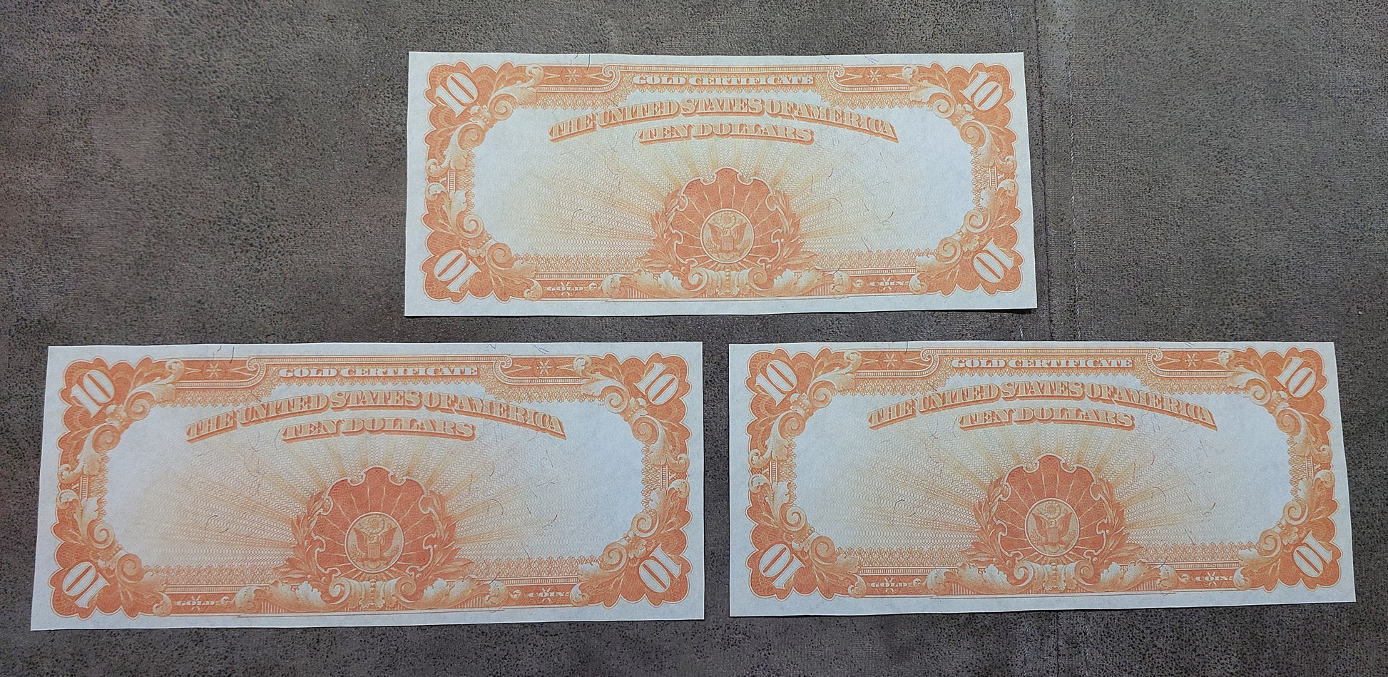 US 10 Dollar 1907 Gold Certificates reverse view showing golden yellow back artwork