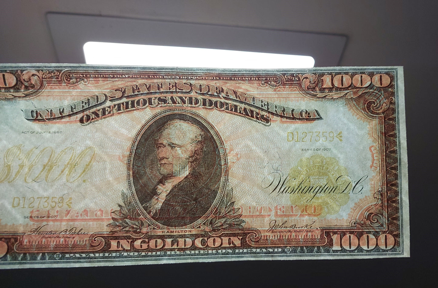 Close-up detailed view of 1907 1000 Dollar Technicolor Gold Certificate showing security paper texture and watermark quality