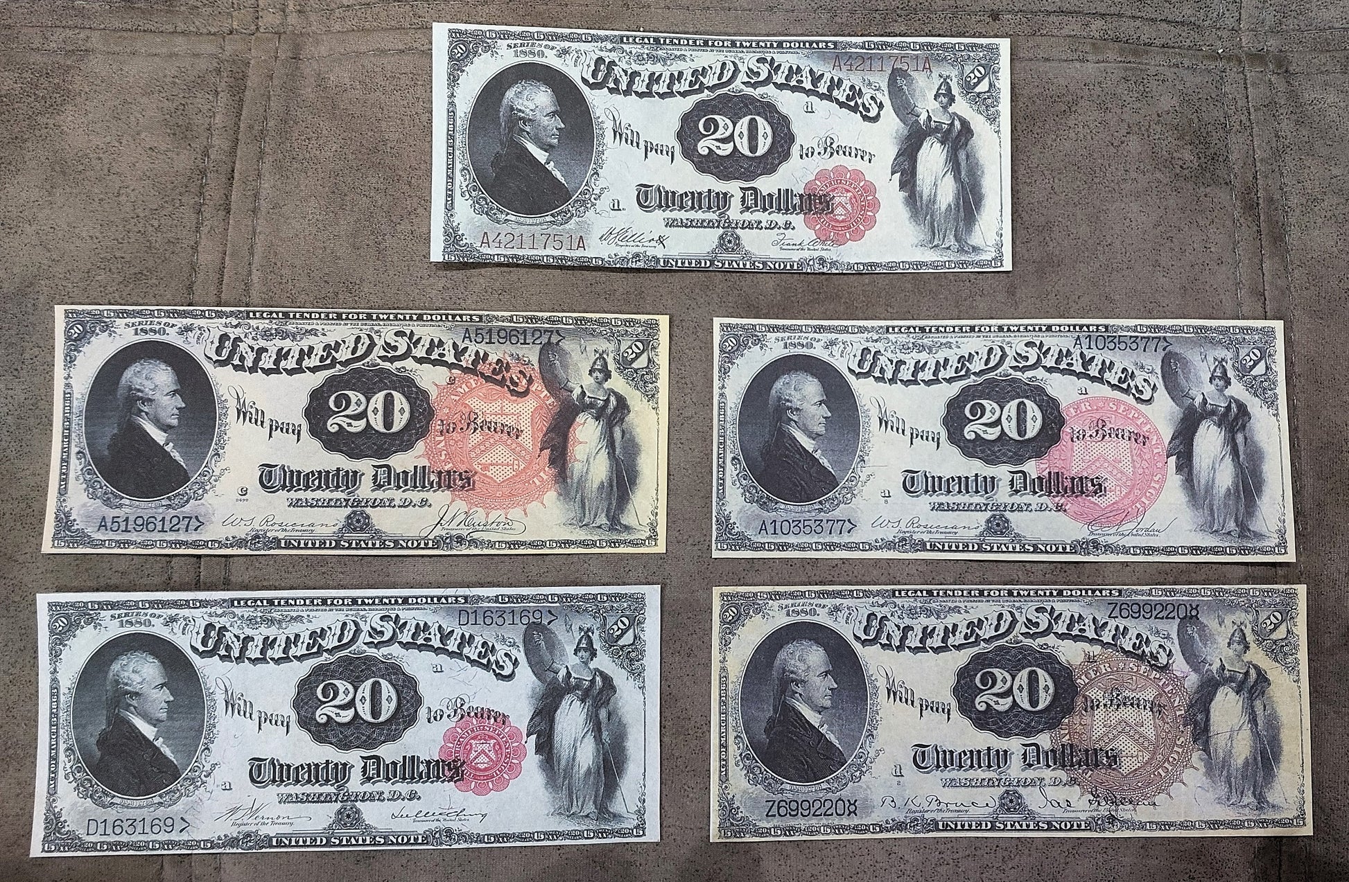 US 20 Dollar 1880 Legal Tender notes showing blue and red serial numbers with flower and sun seals front