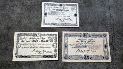 Obverse layout of the 1811 Austria issue Gulden Banco-Zettel banknotes. Features historic imperial era monochrome copperplate typography, ornate imperial crests, and distinct early central bank validation stamps.